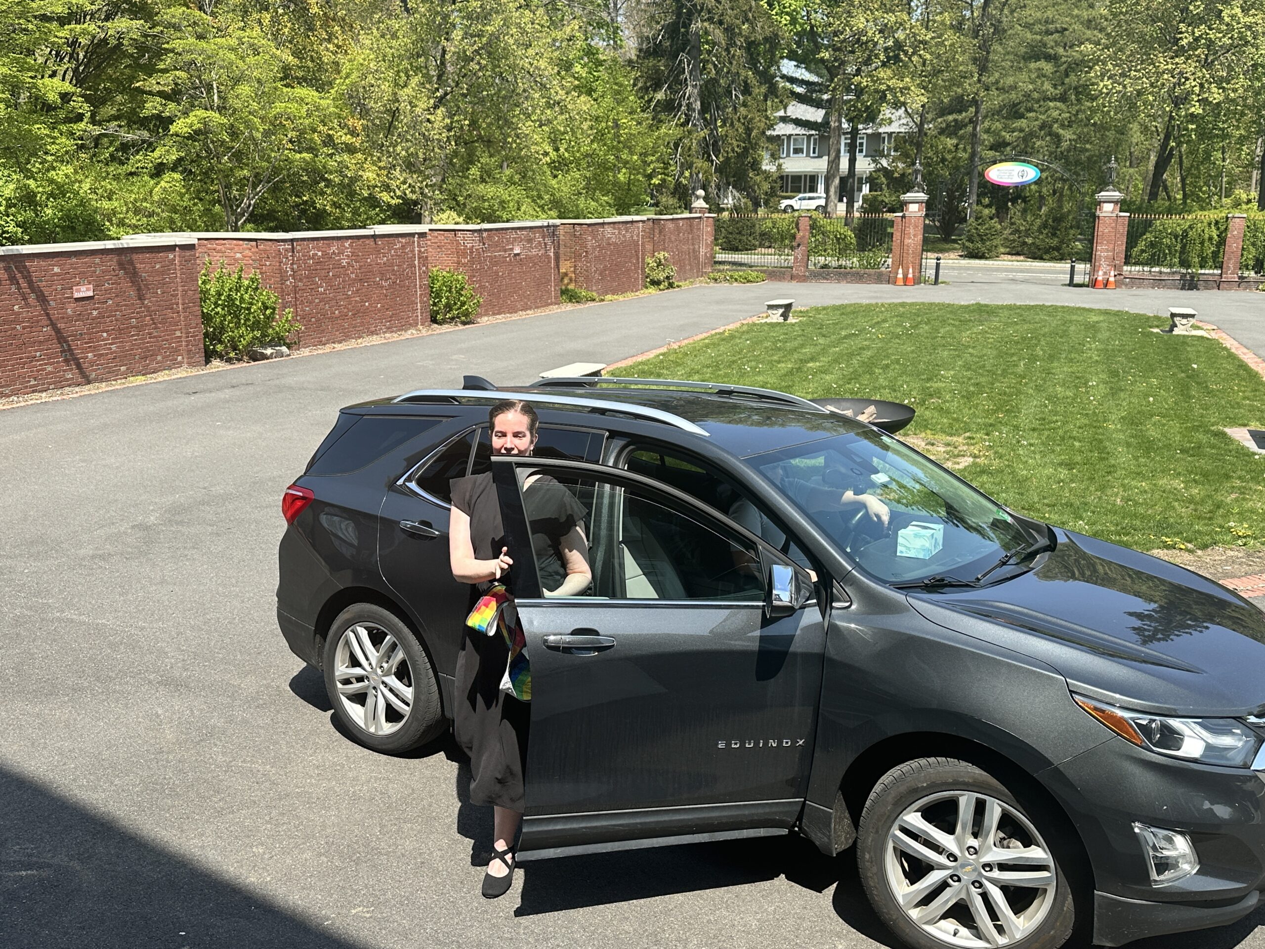 Sasha exiting car