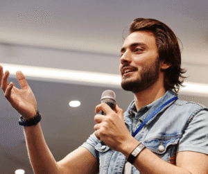 A man speaking with a microphone in his hand