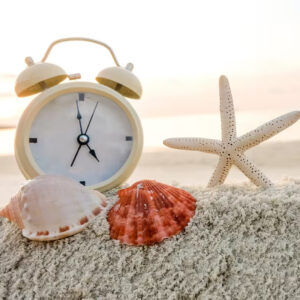 Clock in Sand with Sea Shells